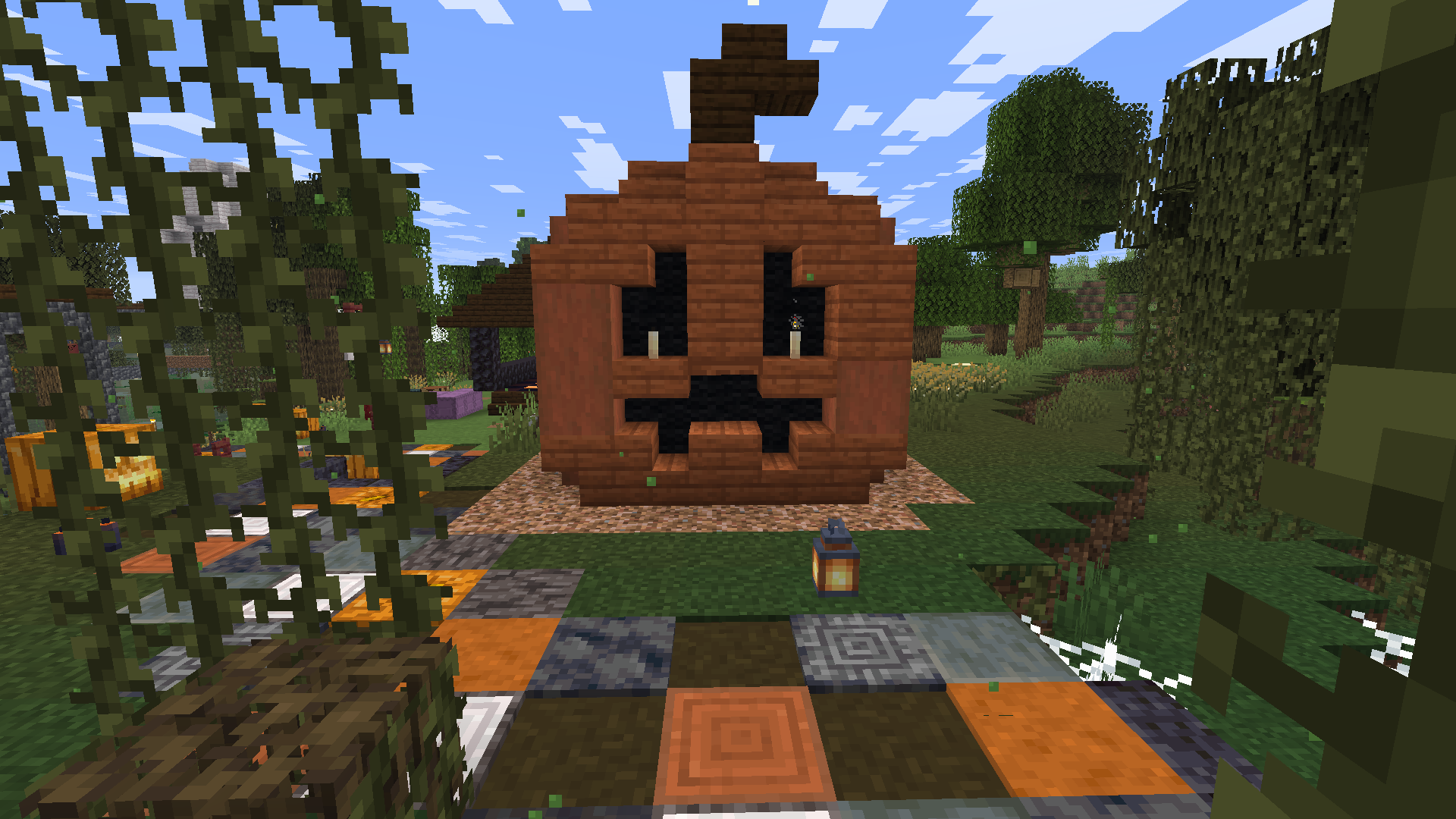 Brick pumpkin-shaped house with candlelit eyes in a village on Alpha Legends