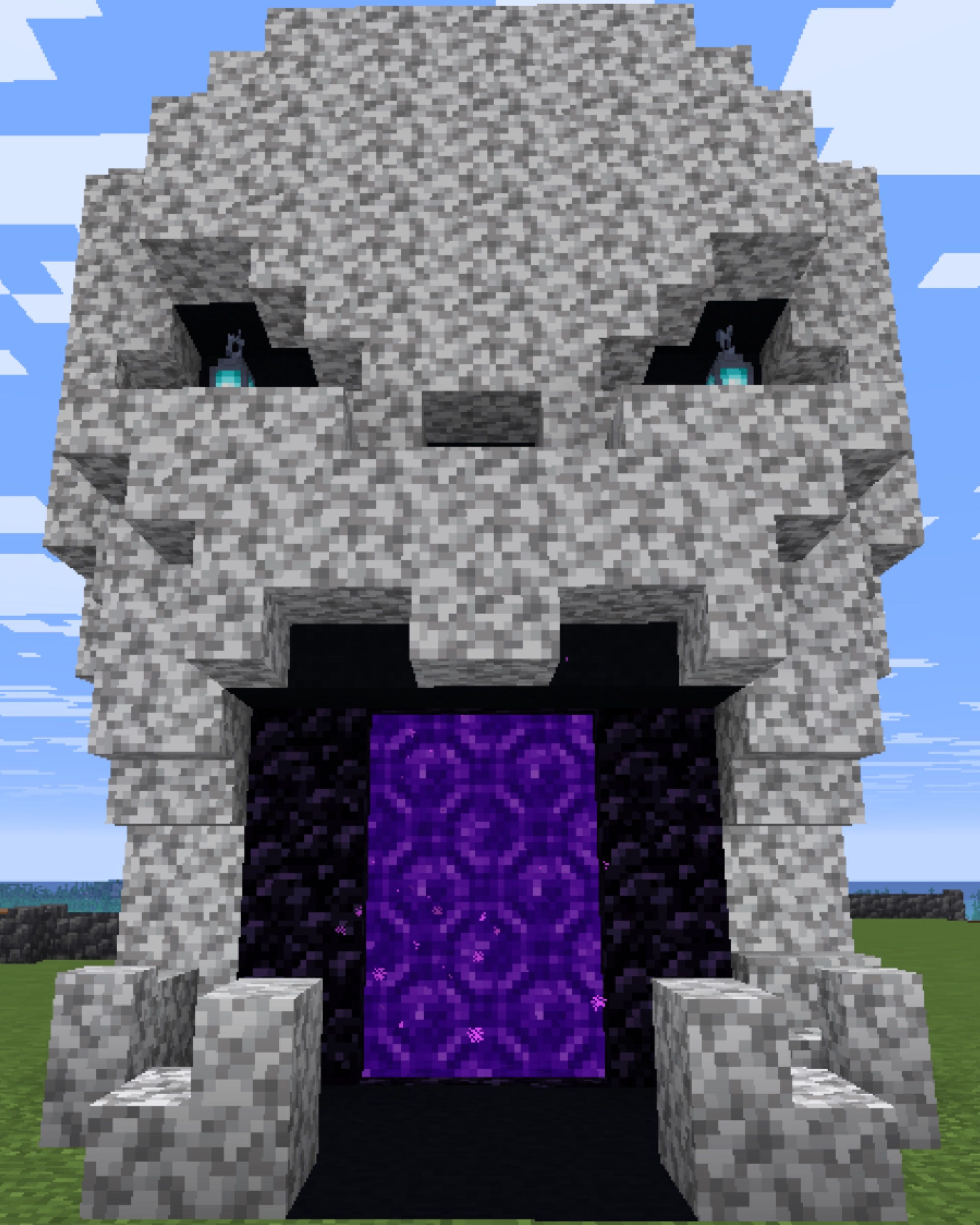 Giant skull-shaped stone build with a glowing nether portal as its mouth on Alpha Legends